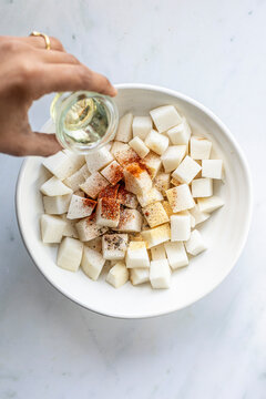 Turnip cubes in a white bowl