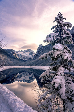 Beautiful snowy winter landscape with Dachstein mountain and Gosausee in Austria near Hallstatt