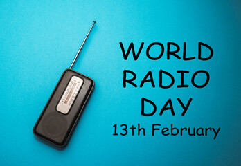 World Radio Day 13 February text with radio on blue background. Selective focus