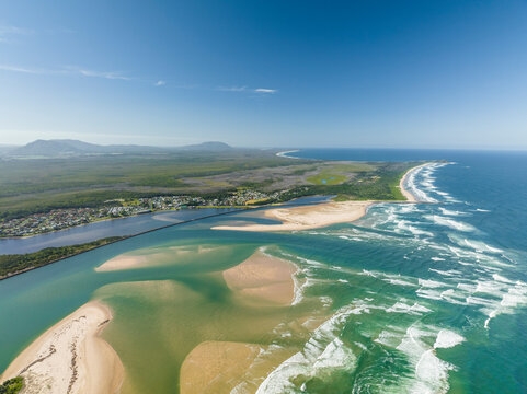Aerial view of the coastline with beach near Manning River, New South Wales, Australia.