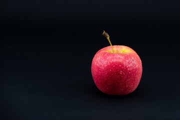 close-up apple on black background