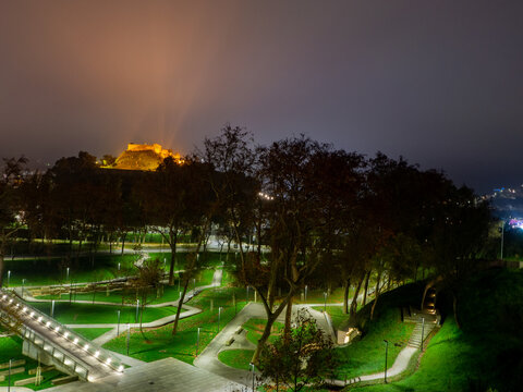 View of the parque do Choupal with the castle up the hill against a clear sky, at night. Torres Vedras &ndash; Portugal
