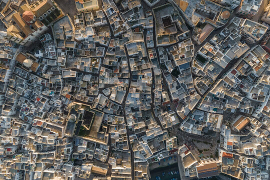 Aerial top down view of Monopoli old town at sunset, Bari, Puglia, Italy.