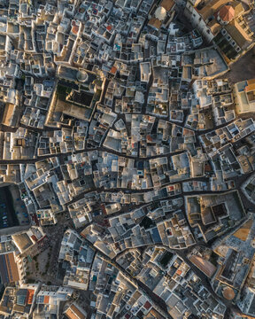 Aerial top down view of Monopoli old town at sunset, Bari, Puglia, Italy.