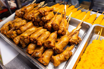 Grill chicken wing skewer in street market