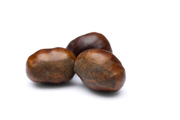 Raw  roasted chestnuts on white background