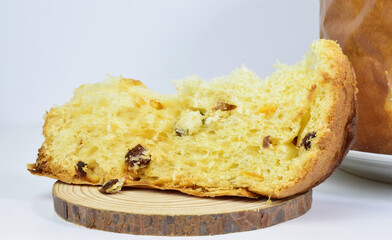 Close up. Panettone portion, typical Italian sweet presented on a light background