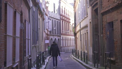 Man walking in empty european street