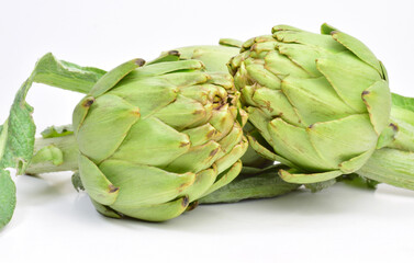 Close up, group artichokes, light background and copy space.