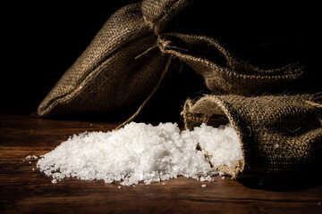 sea salt spilled on wooden background