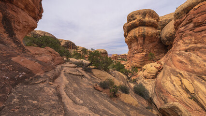 hiking the chesler park loop trail in the needles in canyonlands national park, usa