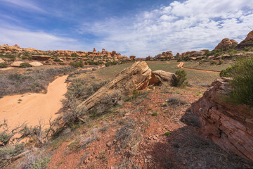 hiking the chesler park loop trail in the needles in canyonlands national park, usa