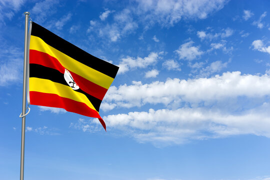 Republic of Uganda Flag Over Blue Sky Background. 3D Illustration