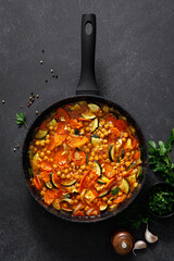 Chickpea and zucchini saute with carrot and garlic. Classic italian side dish. Top view