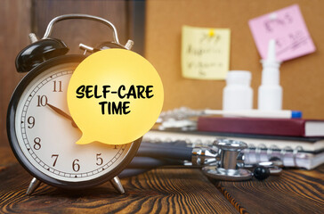 On the alarm clock a sticker with the inscription - Self-care time