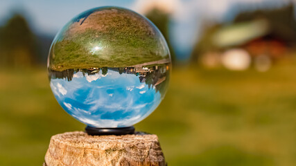 Crystal ball alpine summer landscape shot at the famous Kleinwalsertal valley, Waeldele, Vorarlberg, Austria