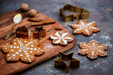 Christmas gingerbread cookies and spices on wooden table