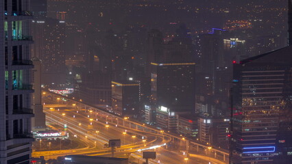 Fototapeta na wymiar Dubai Aerial view showing al barsha heights and greens district area night timelapse