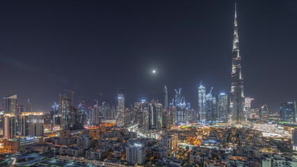 Fototapeta na wymiar Dubai Downtown all night timelapse with tallest skyscraper and other towers