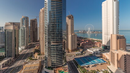 Obraz premium Panoramic view of the Dubai Marina and JBR area and the famous Ferris Wheel aerial timelapse