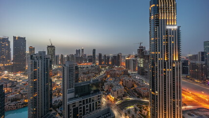Aerial panoramic view of a big futuristic city night to day timelapse. Business bay and Downtown