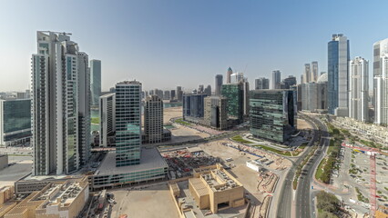 Panorama showing Bay Avenue with modern towers residential development in Business Bay aerial timelapse, Dubai