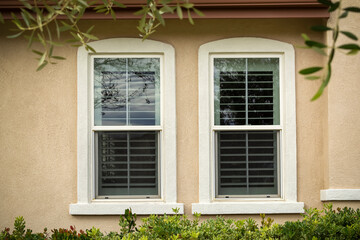 Fototapeta na wymiar Single-Hung windows on stucco wall, exterior close-up view, Menifee, California