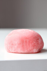 Closeup of pink japanese rice cake. Delicious mochi on white background. Traditional Japanese dessert