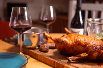 Homemade roasted duck for a dinner party in Denmark with a glass of wine