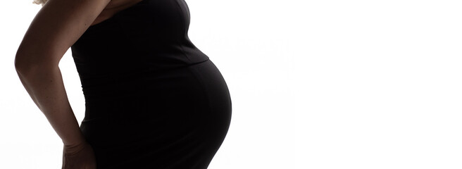 banner. without a face. a pregnant woman in a black dress on a white background