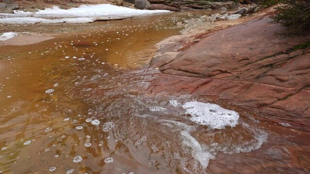 Water flowing down Pine Creek in Zion National Park during winter.