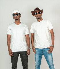 Two african man wearing white blank shirt with a hat and a glasses, doing a simple pose