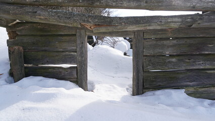 wooden house in the mountains in snow winter