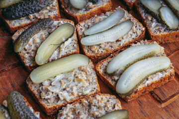 Bread with lard with pickled cucumber on Dozynki Slavic harvest festival, Poland - obrazy, fototapety, plakaty