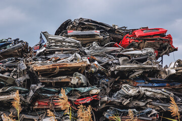 Stacked cars on a junkyard in Poland