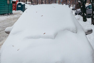 Car fully covered with snow in Warsaw, Poland