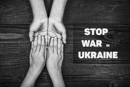 hands holding each other with words stop war