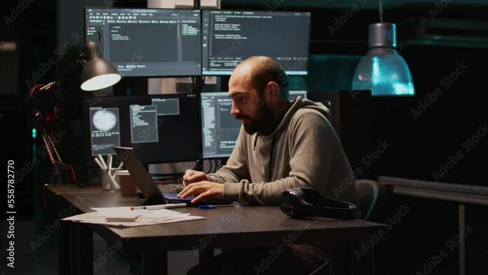 Wall mural young man feeling tired and working on programming code, typing database information and html script