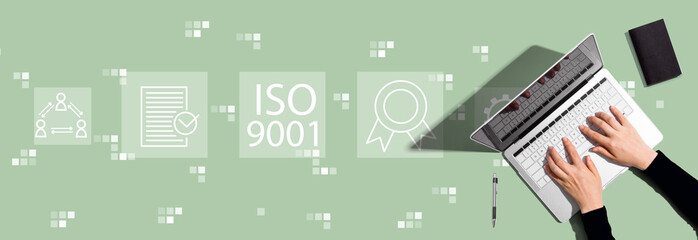 Plakat ISO 9001 concept with person using a laptop computer