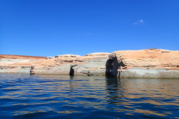 Colorful sandstone rock formations along the Colorado River at Glen Canyon National Recreation Area
