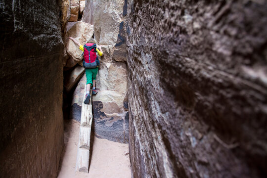 A young girl  backpacking in the Needles District of Canyonlands National Park, Monticello, Utah.
