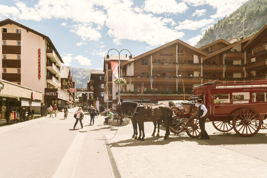 Carriage with horses in mountain village, Zermatt, Valais, Switzerland