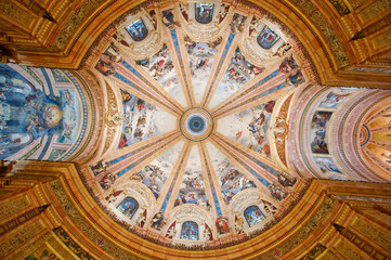 Architectural view of a decorated ceiling in a church.