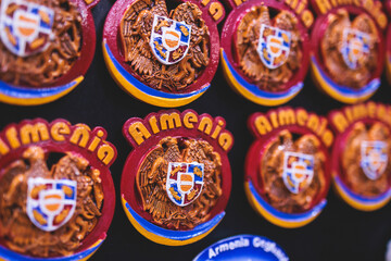View of traditional tourist souvenirs, presents and gifts from Armenia, fridge magnets with text 