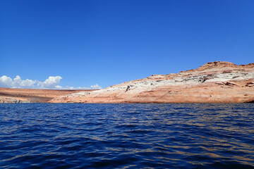 Colorful sandstone rock formations along the Colorado River at Glen Canyon National Recreation Area
