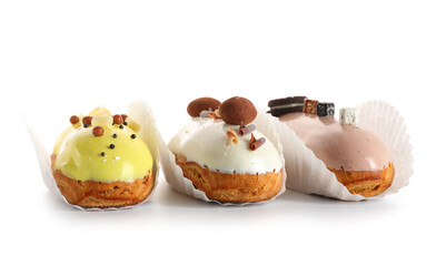 Various glazed eclairs isolated on white background