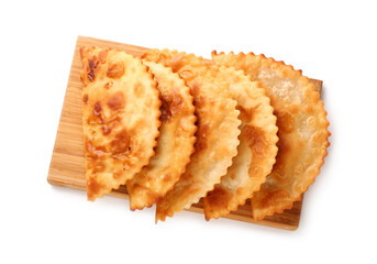 Wooden board with tasty chebureks on white background