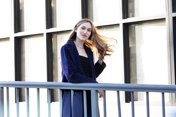 Fototapeta premium Trans woman posing next to a railing.