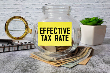 Effective Tax Rate write on a paperwork isolated on wooden background