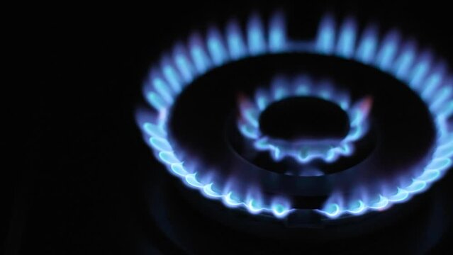 Cooking with Gas Turning on the gas stove on a black background, shot with high speed camera. Top-Side, Locked.mp4